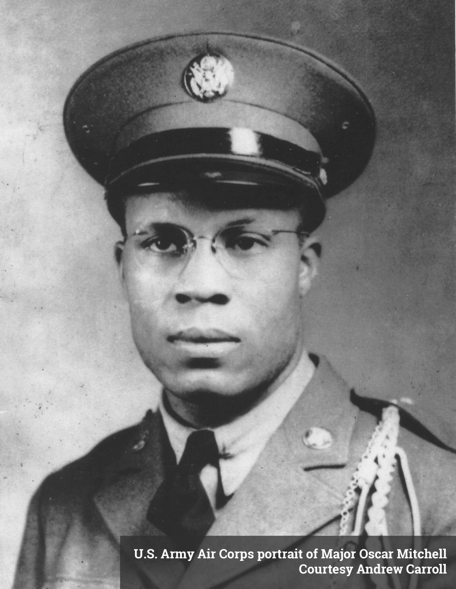 Portrait of a man wearing a military uniform and hat.