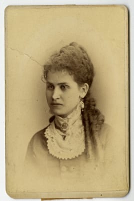 Portrait of a young woman with a high collar bodice.