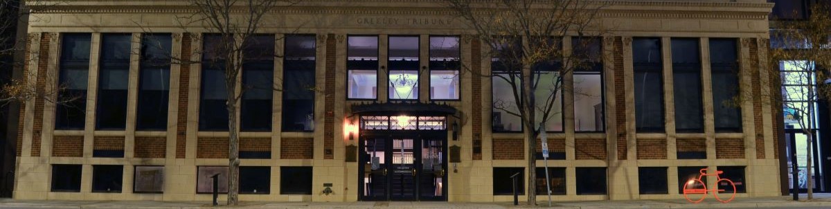 Front exterior of museum building lit at night